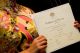Bride holding marriage certificate