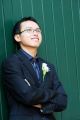 Groom - standing by wall