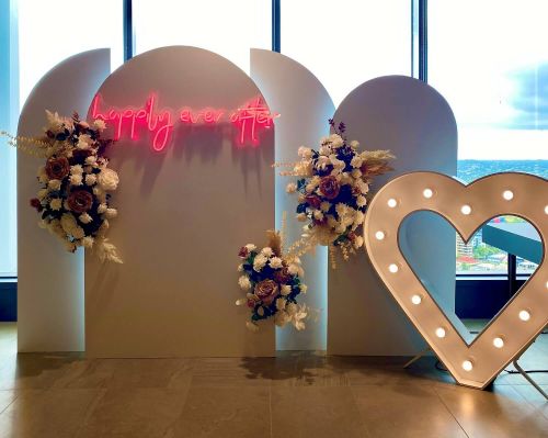 Happily Ever After' wedding backdrop at Registry of Births, Deaths and Marriages ceremony room for Valentine's Day.